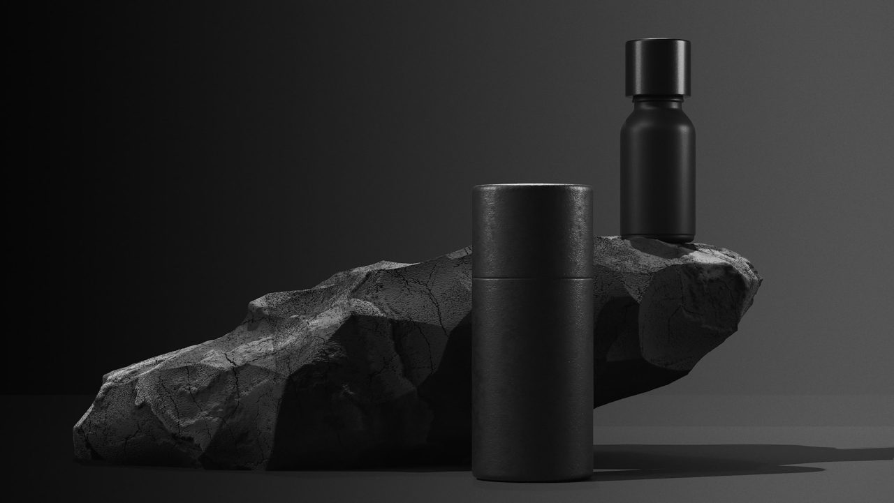 bottle of essential massage oil on stone beauty treatment minimal black design packaging mock up -